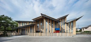 kengo kuma tops kindergarten in japan with multiple pitched roofs