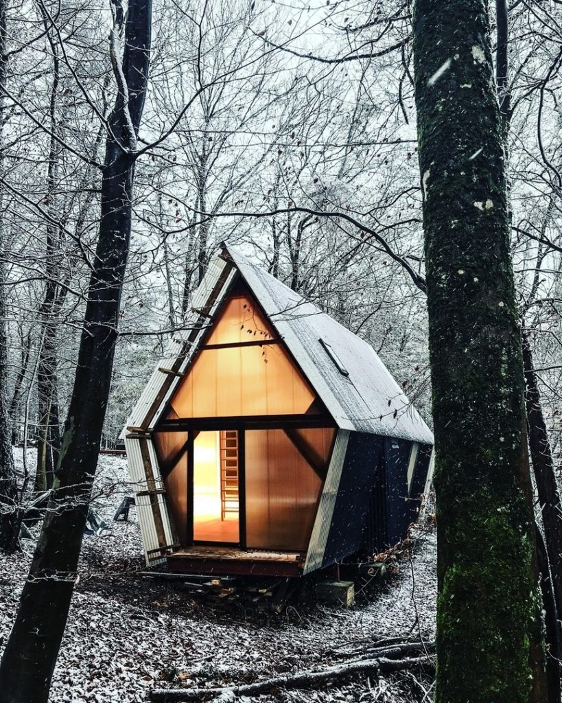 Invisible Studio combines home-grown timber and construction waste materials in an economical self-built relocatable house