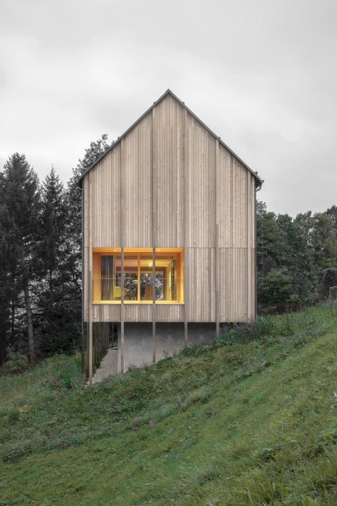 Bernardo Bader perches larch-clad home over concrete plinth in Austrian mountains