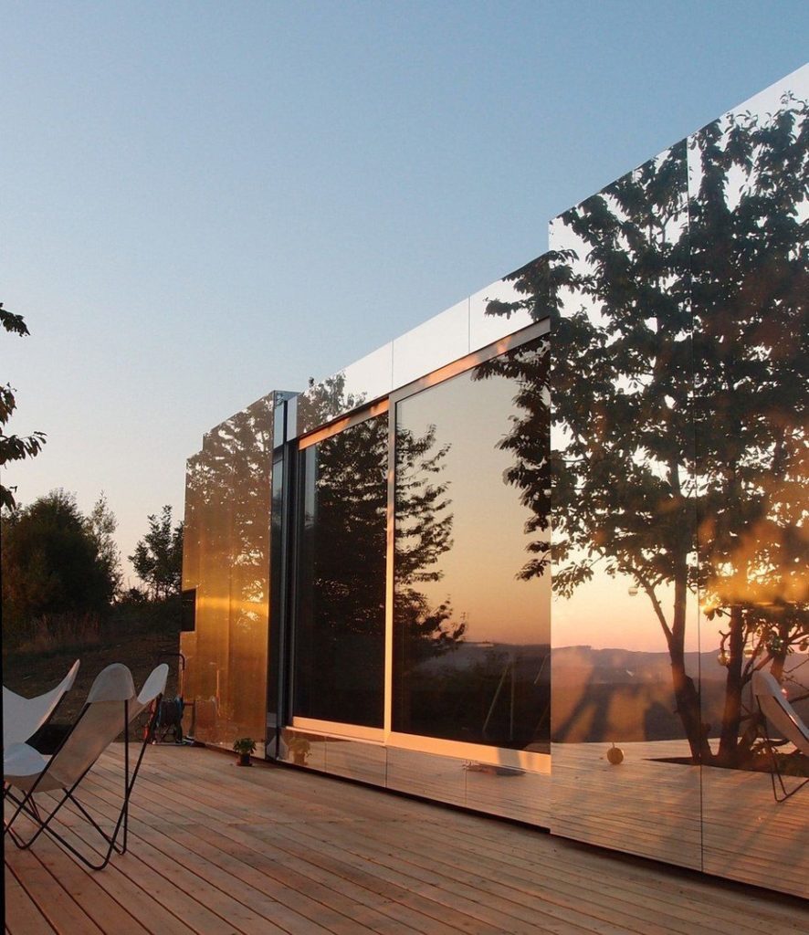 delugan meissl's prefabricated home serves as an invisible retreat