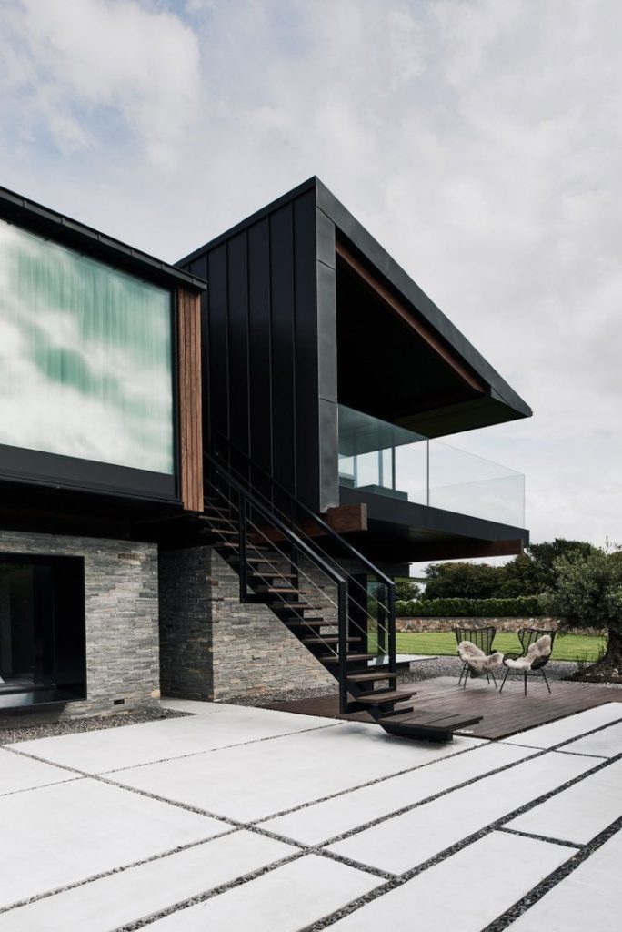 Silver House by Hyde   Hyde comprises pair of mono-pitched volumes perched on a stone plinth