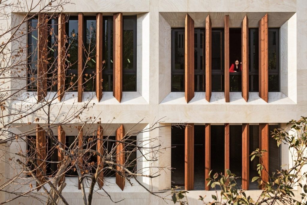 Tehran office building by AWE Office features faceted windows and louvres