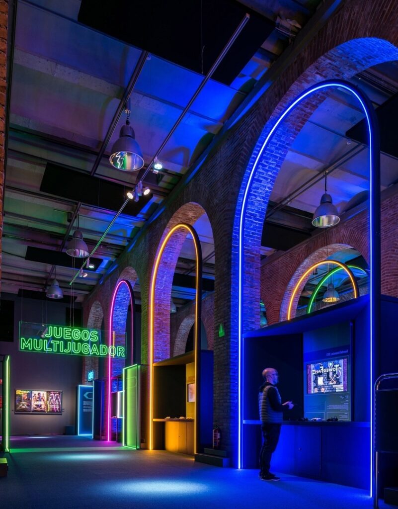 Game On's neon-filled exhibition design pays homage to 80s video games