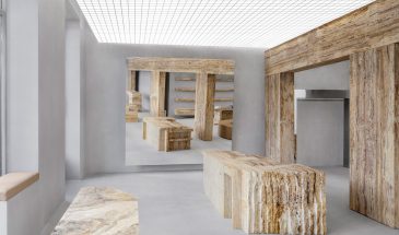 Halleroed inserts sculptural travertine display plinths in Axel Arigato’s Paris store